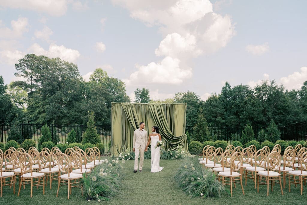 Couple celebrating with a garden wedding in the Rose Garden at Donovan Manor