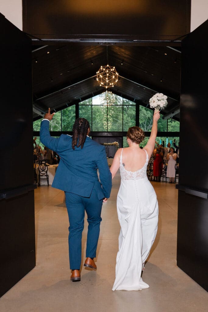 bride and groom enter wedding reception in Pittsboro, NC